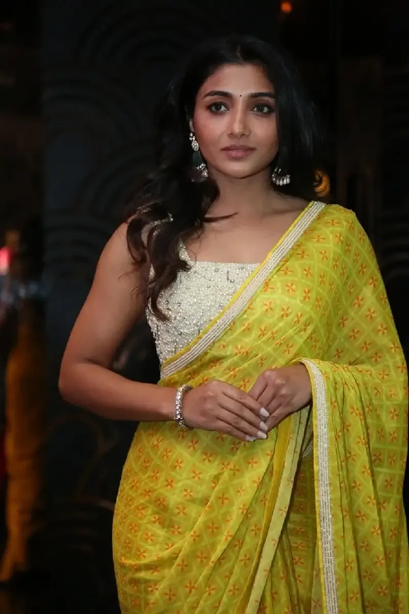 Indian Actress Mirnaa Menon in Yellow Saree at Ugram Movie Teaser Launch